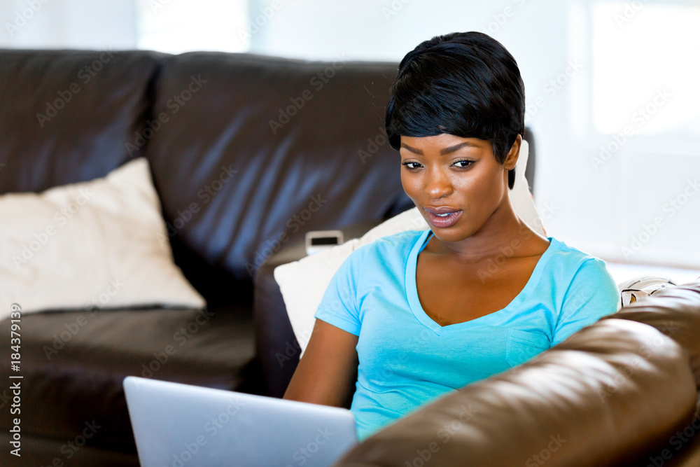 Young beautiful woman working on her laptop Young beautiful woman working on her laptop