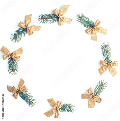 Christmas and New Year composition with branches of spruce and bows in the style of minimalism isolated