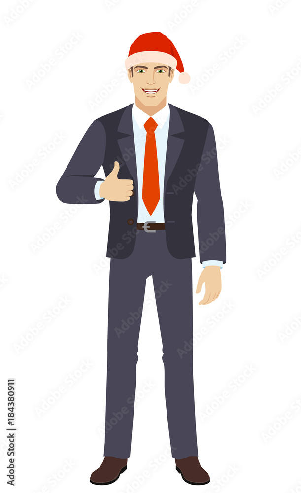Businessman in Santa hat showing thumb up Businessman in Santa hat showing thumb up