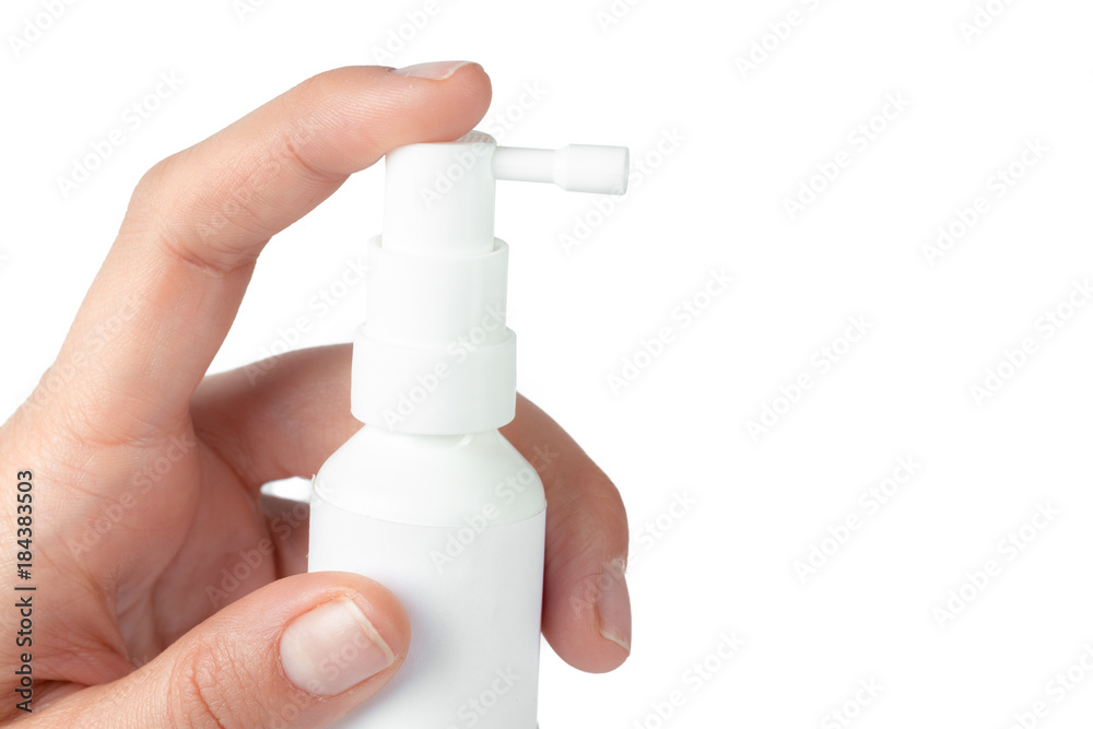 Nasal spray in a human hand isolated on white background Nasal spray in a human hand isolated on white background