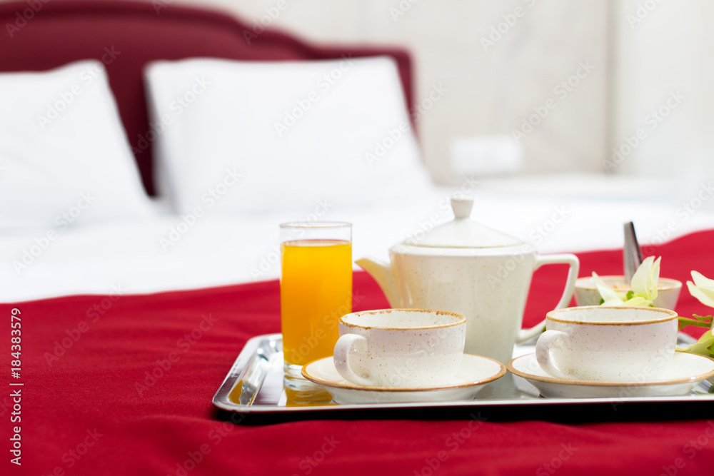 Breakfast in bed in hotel room