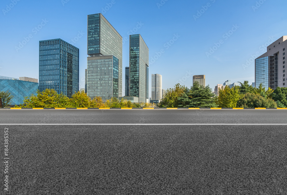 empty asphalt road with city skyline background in china..