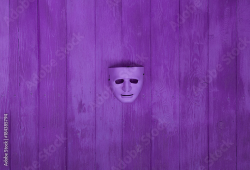 purple mask on the violet wall