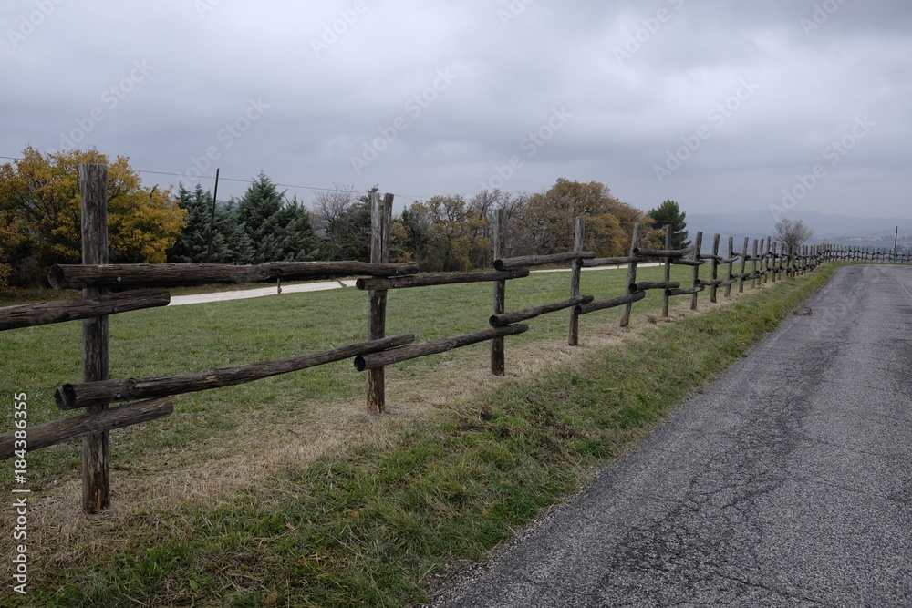 wooden fence along the road