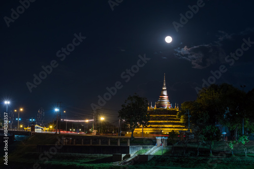 Super moon in night sky and silhouette of ancient pagoda is named Wat Ratchaburana  Phitsanulok in Thailand
