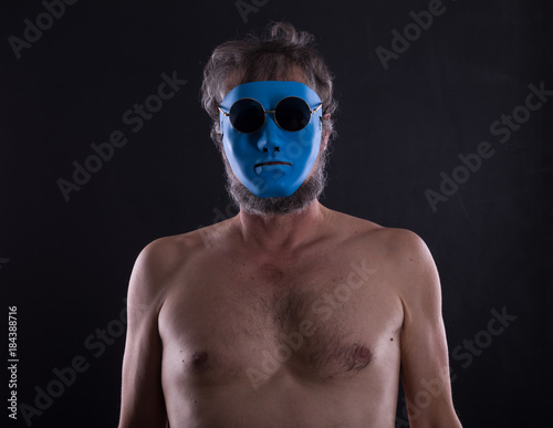 naked man in blue mask