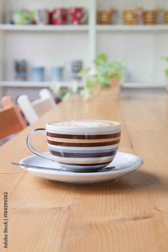 Coffee on a wooden table in a coffee shop