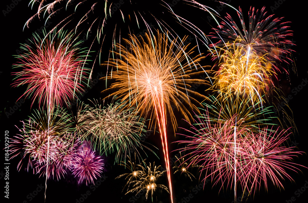 Colourful Fireworks at night over dark sky to celebrate New Year eve and special occasion on holidays Colourful Fireworks at night over dark sky to celebrate New Year eve and special occasion on holidays