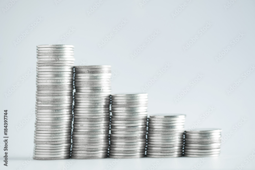 Stacks of coins on working table, finance and business concept, shallow focus..