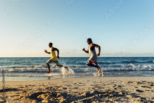 Two cuban friends having fun in the beach.