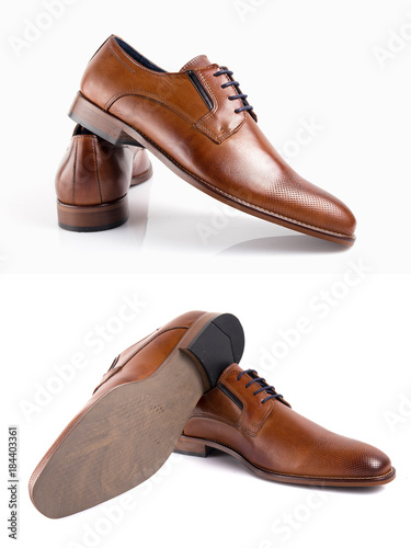 Male brown leather elegant shoe on white background, isolated product, footwear. © GeorgeVieiraSilva
