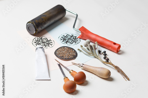 Greeting card on a dark wooden shabby background with old art tools. Top view