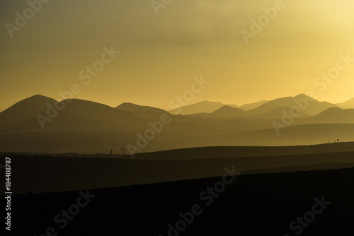 Sunset sun on Lanzarote  landscape of Canary Islands  sunset over volcanoes.