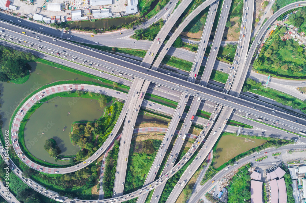 Naklejka premium Traffic road junction view from above with green tree