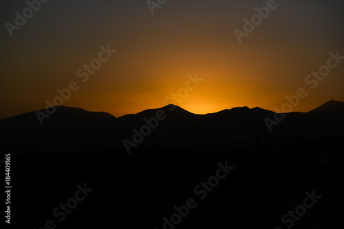 Sunset sun on Lanzarote  landscape of Canary Islands  sunset over volcanoes.