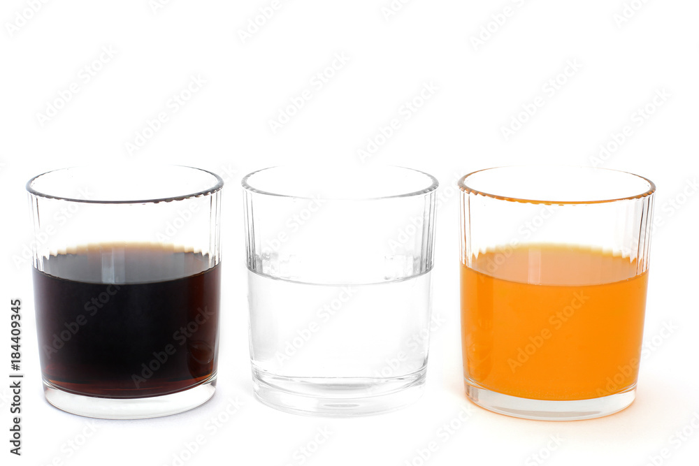 Different drinks in three glasses. Water in a glass on a white background. Drink. Glass