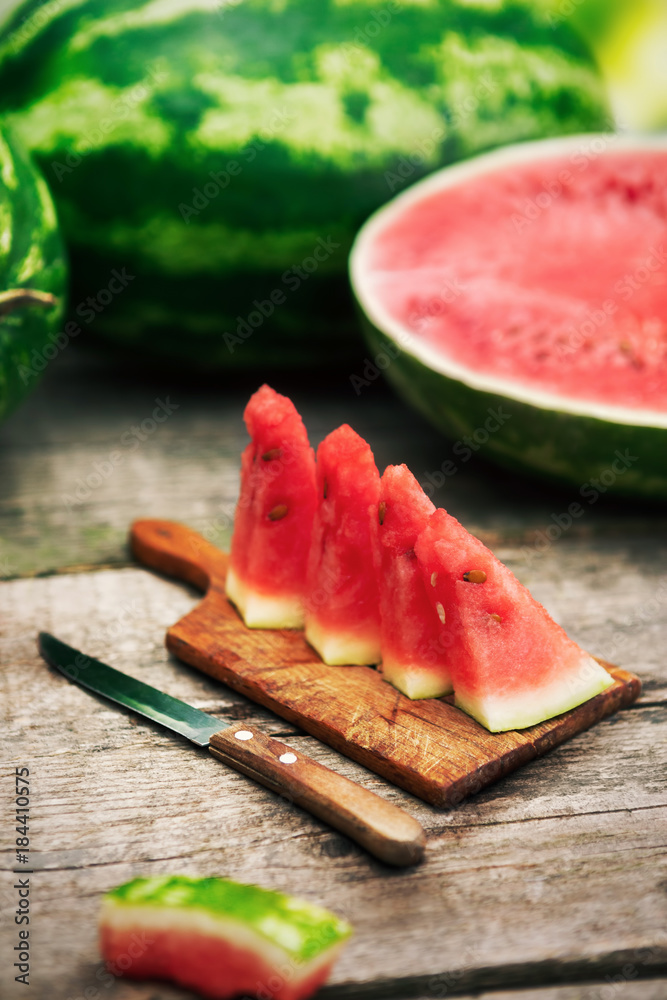 Watermelon cuts on chopping board