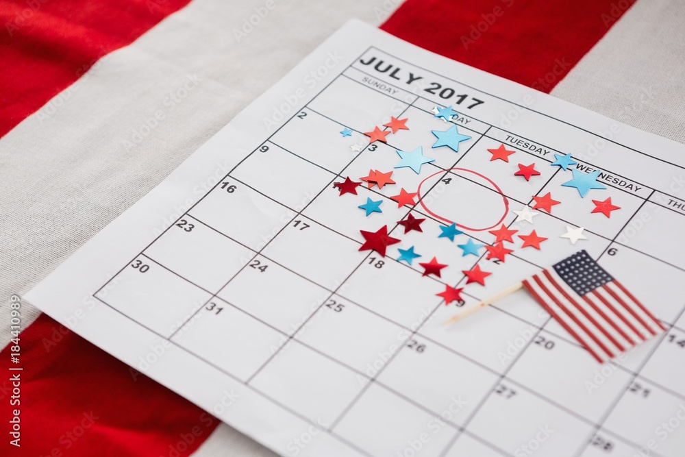 Calendar marked with star shape decoration and American flag Calendar marked with star shape decoration and American flag