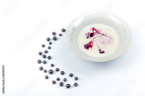 Bowl of greek yogurt and fresh berries isolated on white background. Berries