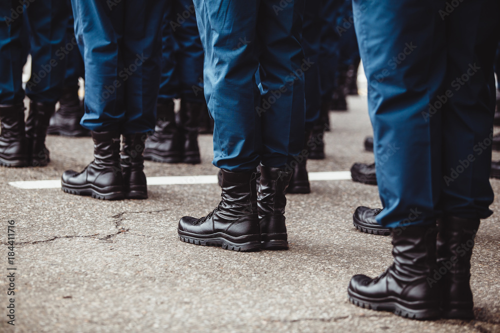 military men in blue dress uniform stand at attention
