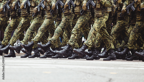 military men in green dress uniform marching to victory parade