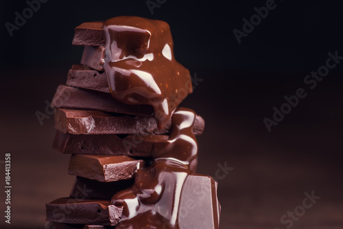 melted chocolate pouring into a piece of chocolate bars