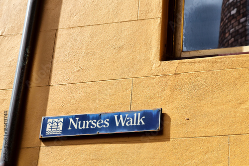  in the wall the sign of nursers walk  street photo