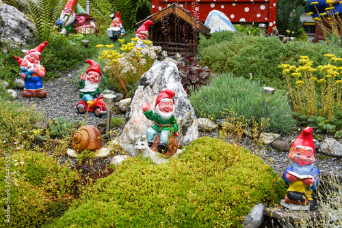 Tablou pe pânză Garden gnomes in a garden of a house at Engelberg
