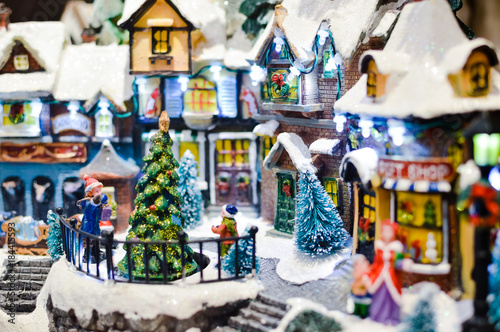 Christmas music cottage toy miniature for joyful seasonal decorated ornament background.