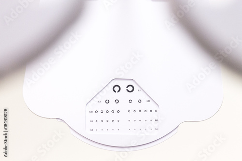 the cabinet of the eye doctor. eye sight test called landolt C. with copy space photo