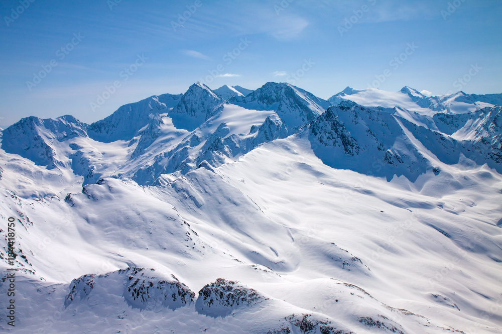 Winter snow covered mountain peaks Austrian alps