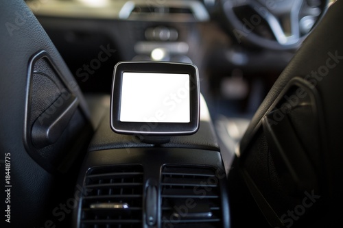 Digital screen amidst seats in car © WavebreakMediaMicro