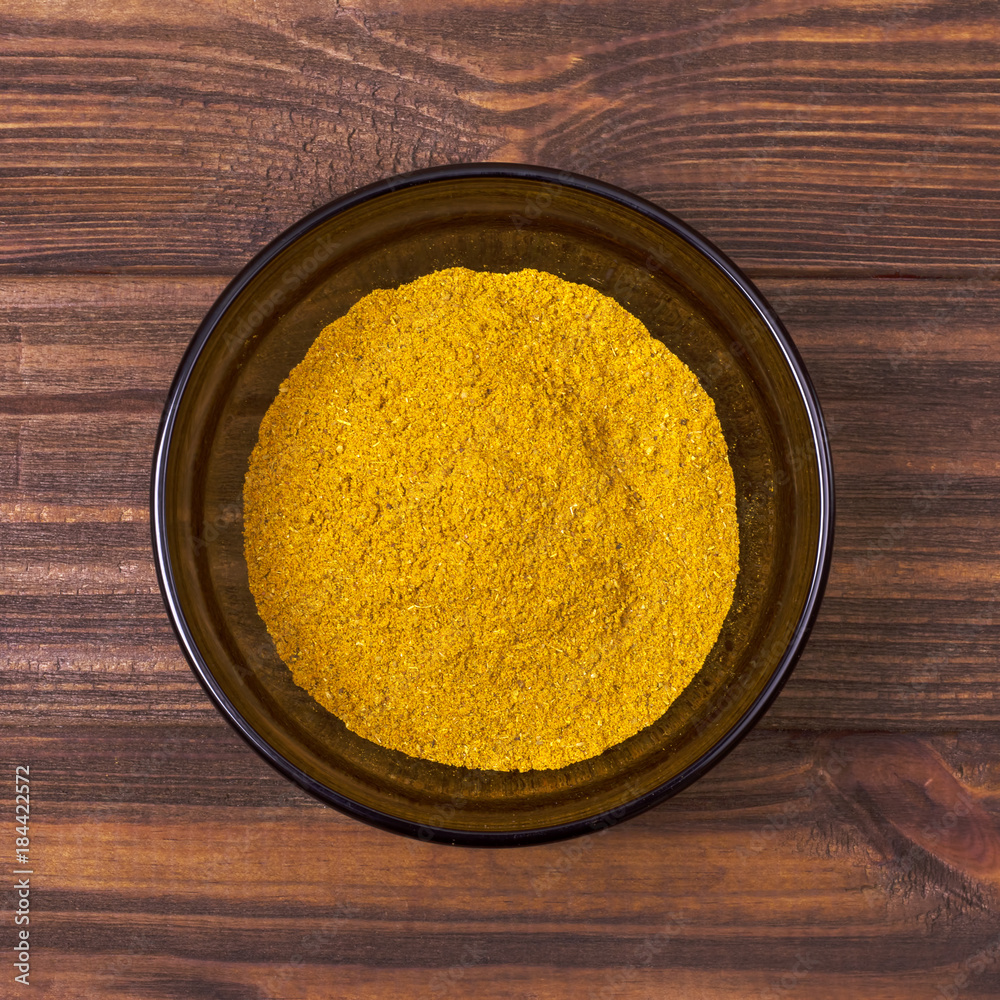 Spice mix - turmeric, pimento, chili, coriander, cardamom, cinnamon, cloves, cumin in a bowl Spice mix - turmeric, pimento, chili, coriander, cardamom, cinnamon, cloves, cumin in a bowl