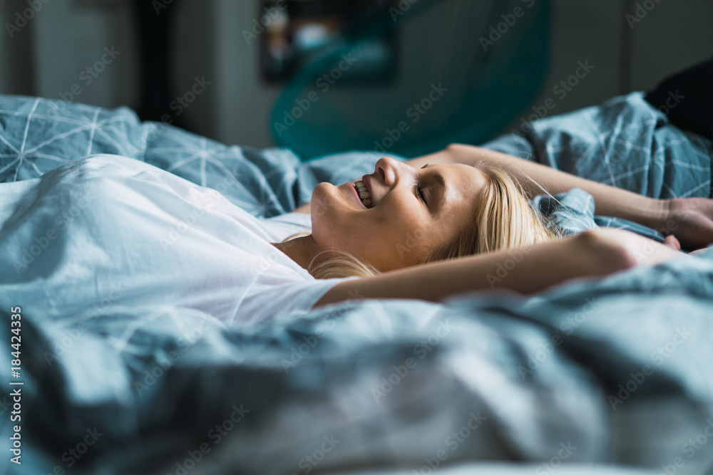 Blonde Woman Lying In Bed Stock Photo 