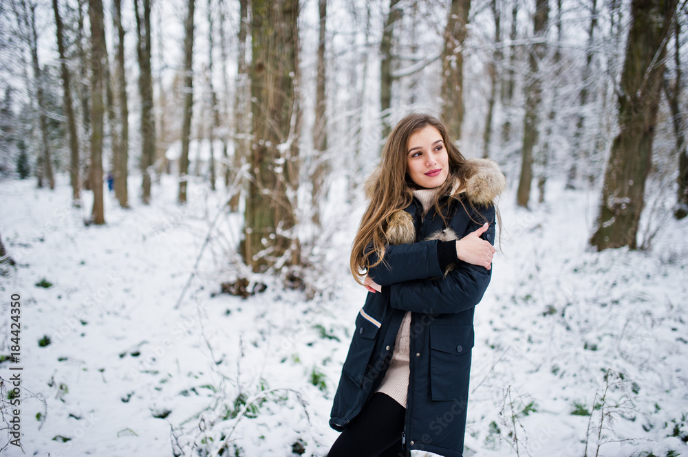Beautiful brunette girl in winter warm clothing. Model on winter jacket. Beautiful brunette girl in winter warm clothing. Model on winter jacket.