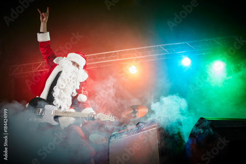 Santa Claus plays rock.