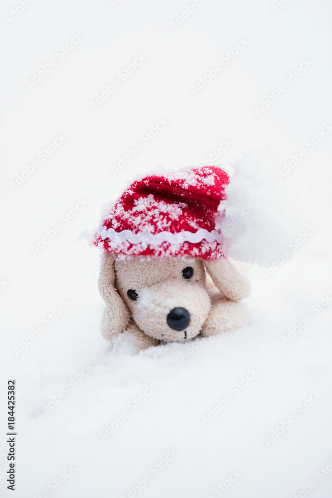 Small plush dog in Santa hat