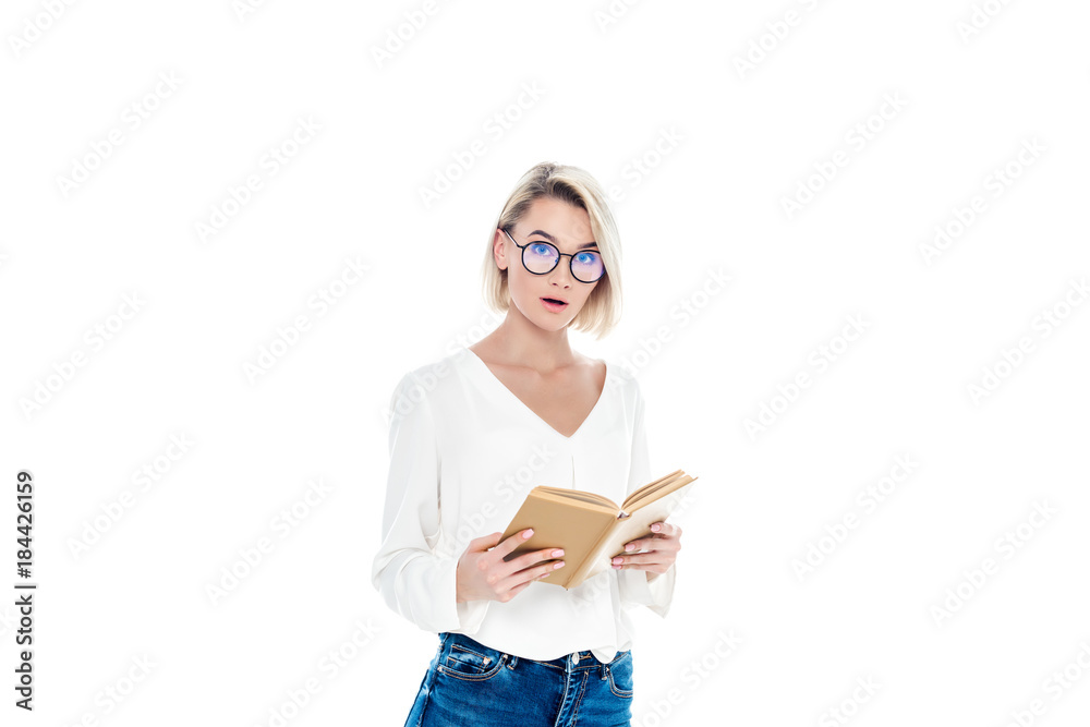 beautiful surprised student in eyeglasses reading book, isolated on white beautiful surprised student in eyeglasses reading book, isolated on white
