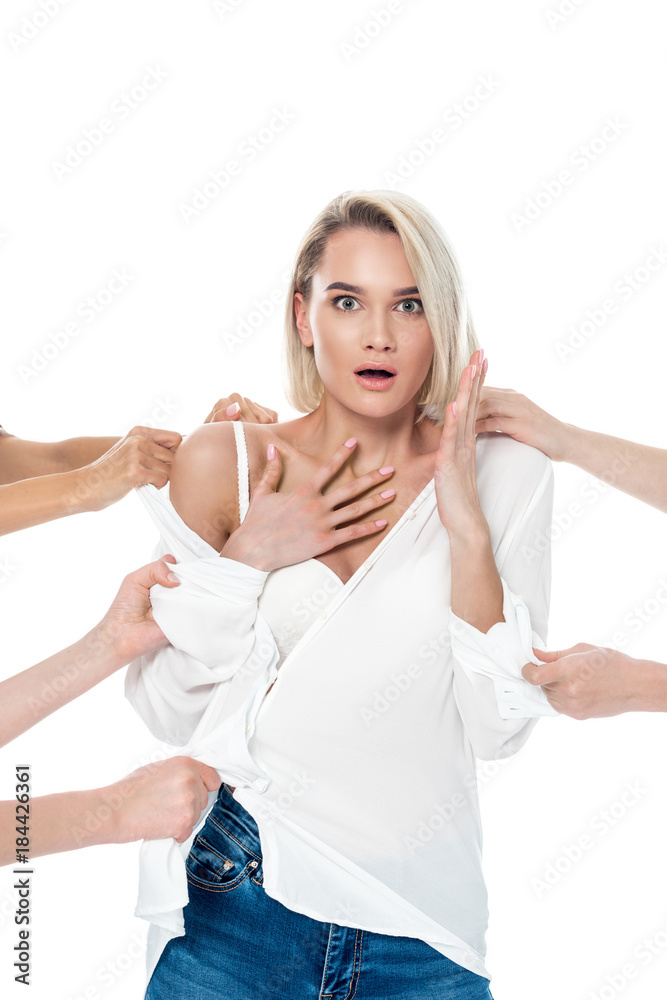 many hands undressing stylish shocked girl, isolated on white many hands undressing stylish shocked girl, isolated on white