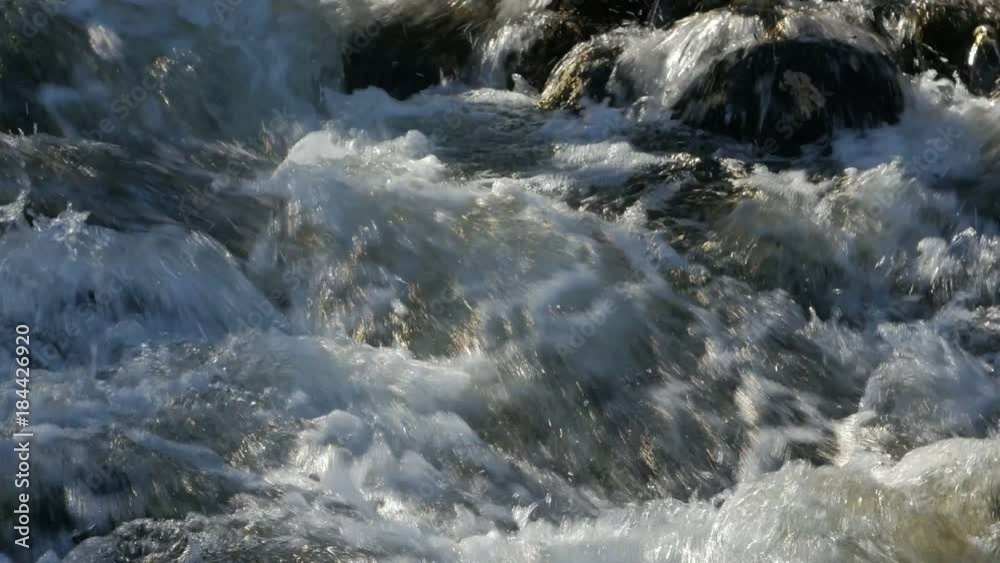 Close up of water stream with white and transparent bubbles. Zoom. Close up of water stream with white and transparent bubbles. Zoom.