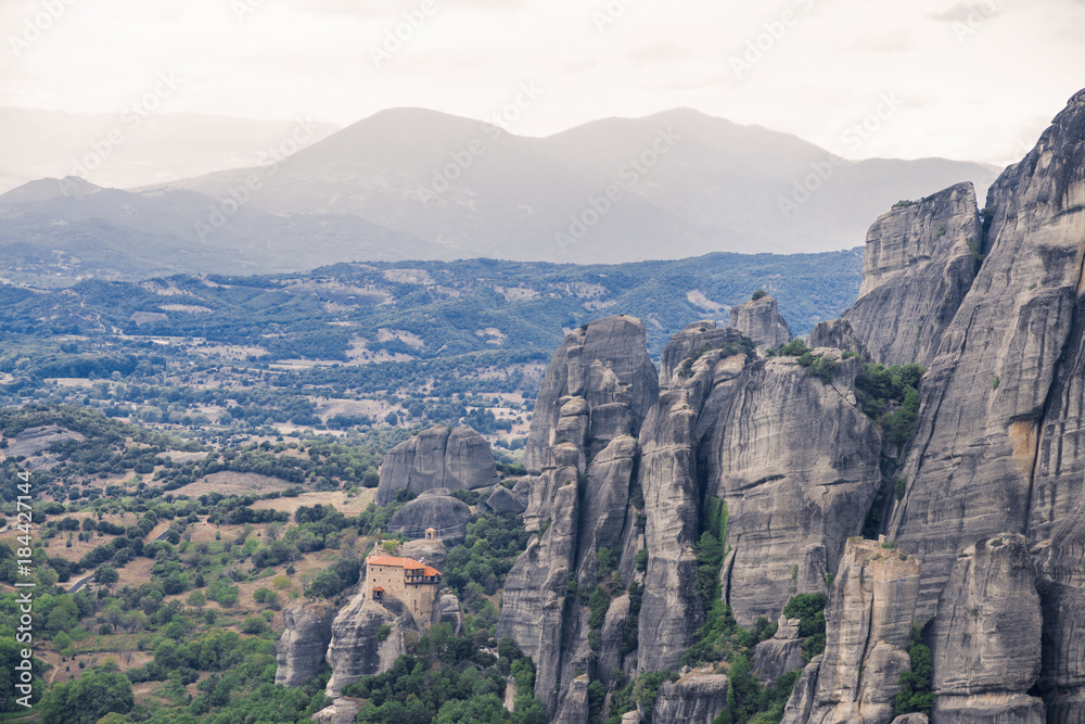 Landscape of monasteries of Meteora in Greece. Roussanou Monastery and St. Nikolaos Anapafsas Monastery in Trikala region. Landscape of monasteries of Meteora in Greece. Roussanou Monastery and St. Nikolaos Anapafsas Monastery in Trikala region.