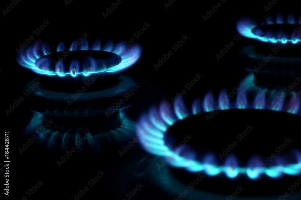 Gas burning in the burner over black background. Gas burning in the burner over black background.