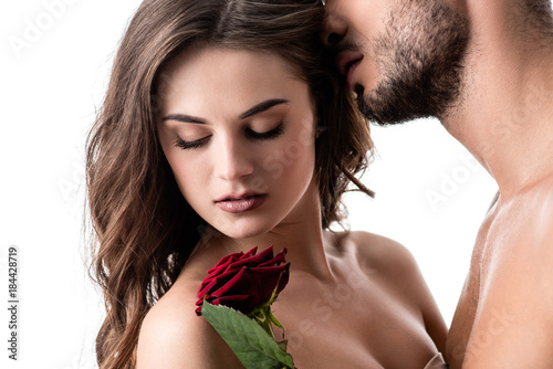 acctractive sensual couple with rose isolated on white photo
