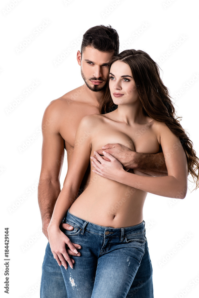 young sensual couple in jeans isolated on white young sensual couple in jeans isolated on white