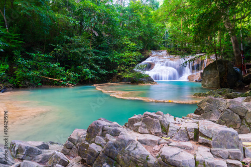 Fototapeta Naklejka Na Ścianę i Meble -  The beauty of limestone waterfall is popular with tourists. And famous of Thailand. In Erawan Waterfall National Park Kanchanaburi