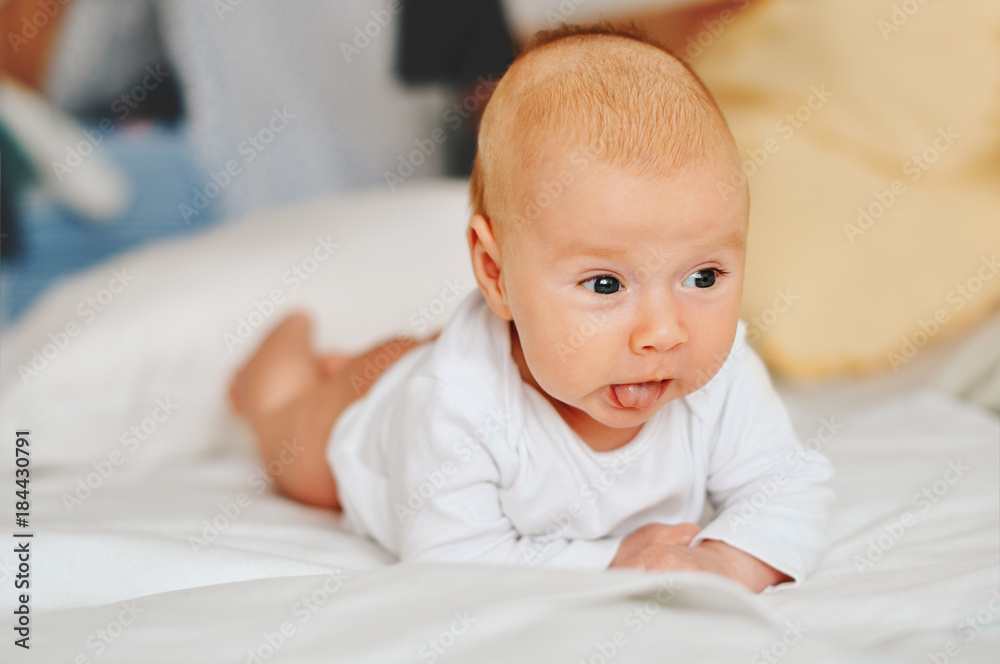 Portrait of adorable 3 month old baby boy lying on the tummy Portrait of adorable 3 month old baby boy lying on the tummy