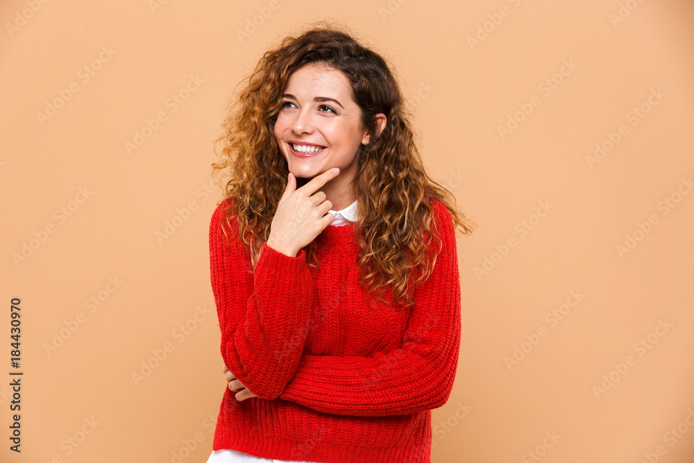 Portrait of a pensive smiling girl looking away Portrait of a pensive smiling girl looking away