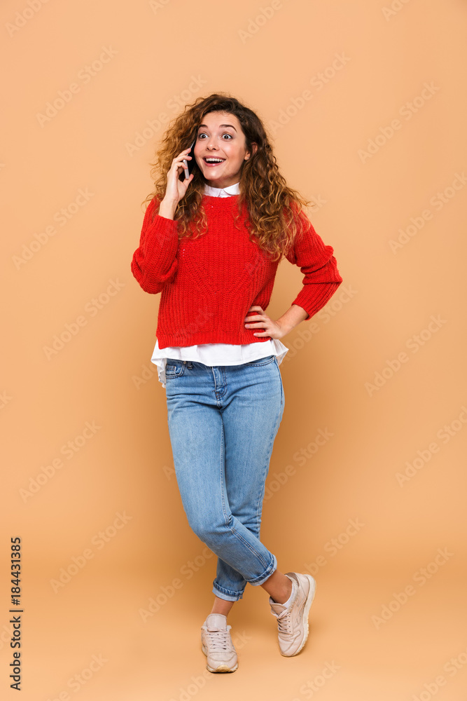 Full length portrait of a cheerful excited girl Full length portrait of a cheerful excited girl