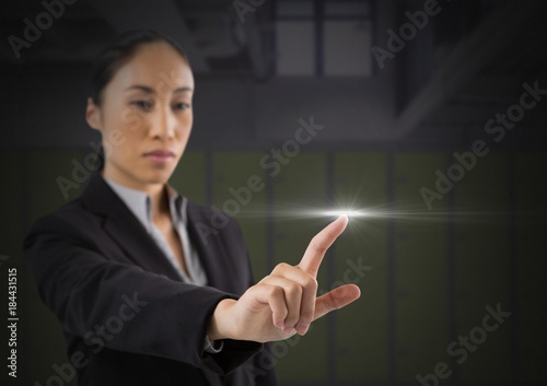 Businesswoman touching air glow