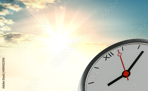 Clock against the background of sunrise
